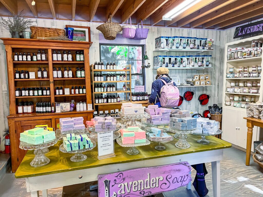 A woman shopping for lavender products in the gift shop at Lavender Ridge Farms in Texas.
