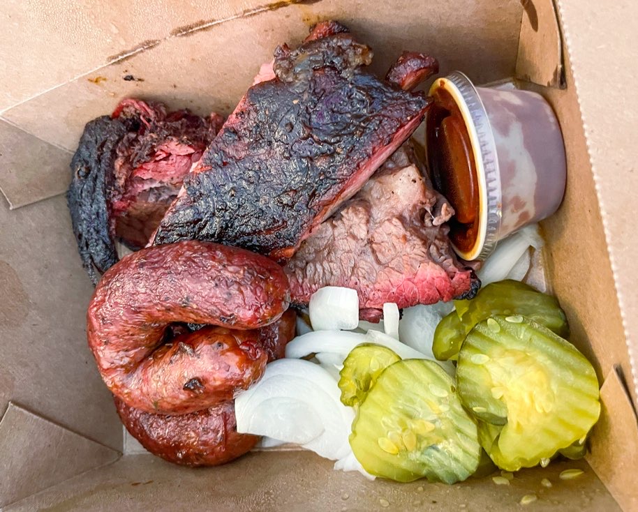 BBQ meat and sausage links at Pecan Lodge in Dallas itinerary guide