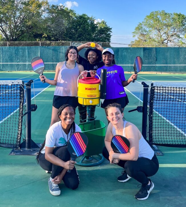 Girls posing for photo at Dallas Pickleball courts