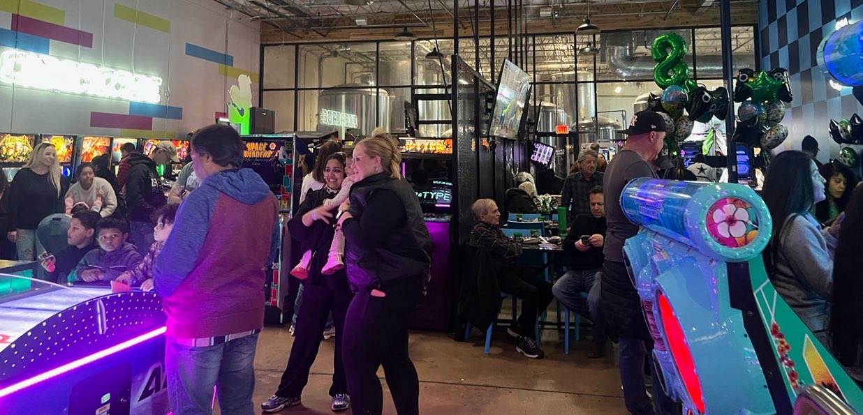 people having fun at dallas arcade bar