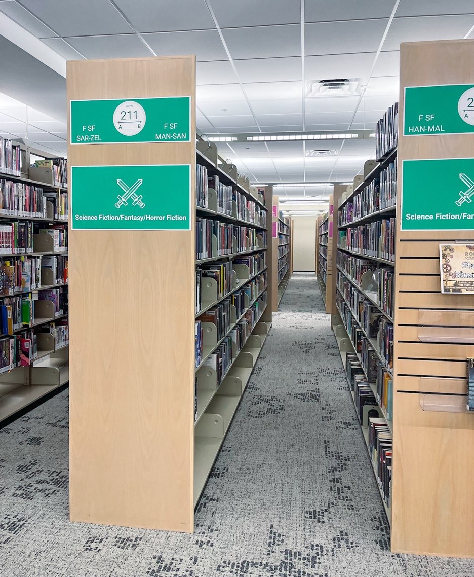Shelves of science fiction books available to read or check out at Lewisville branch library