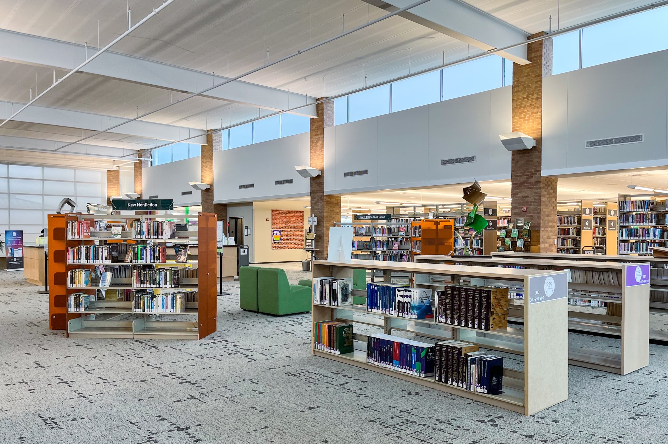 Open seating area with short bookshelves for relaxed reading at the Lewisville branch library