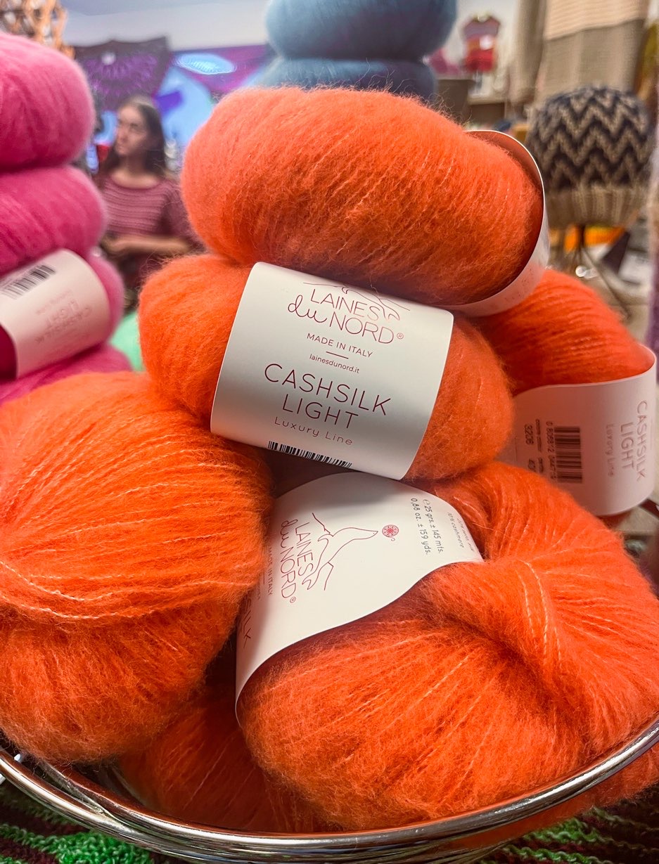 Striking orange cashsilk yarn at Knit Dallas; North Texas yarn crawl