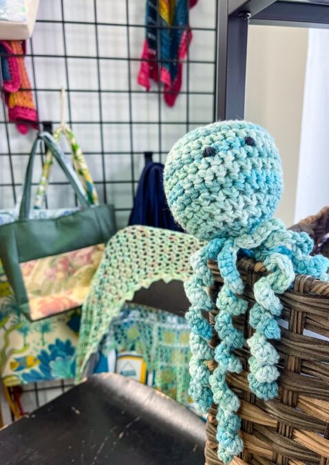 cute crocheted light blue and white octopus at Krit Dallas yarn shop during fiber fest
