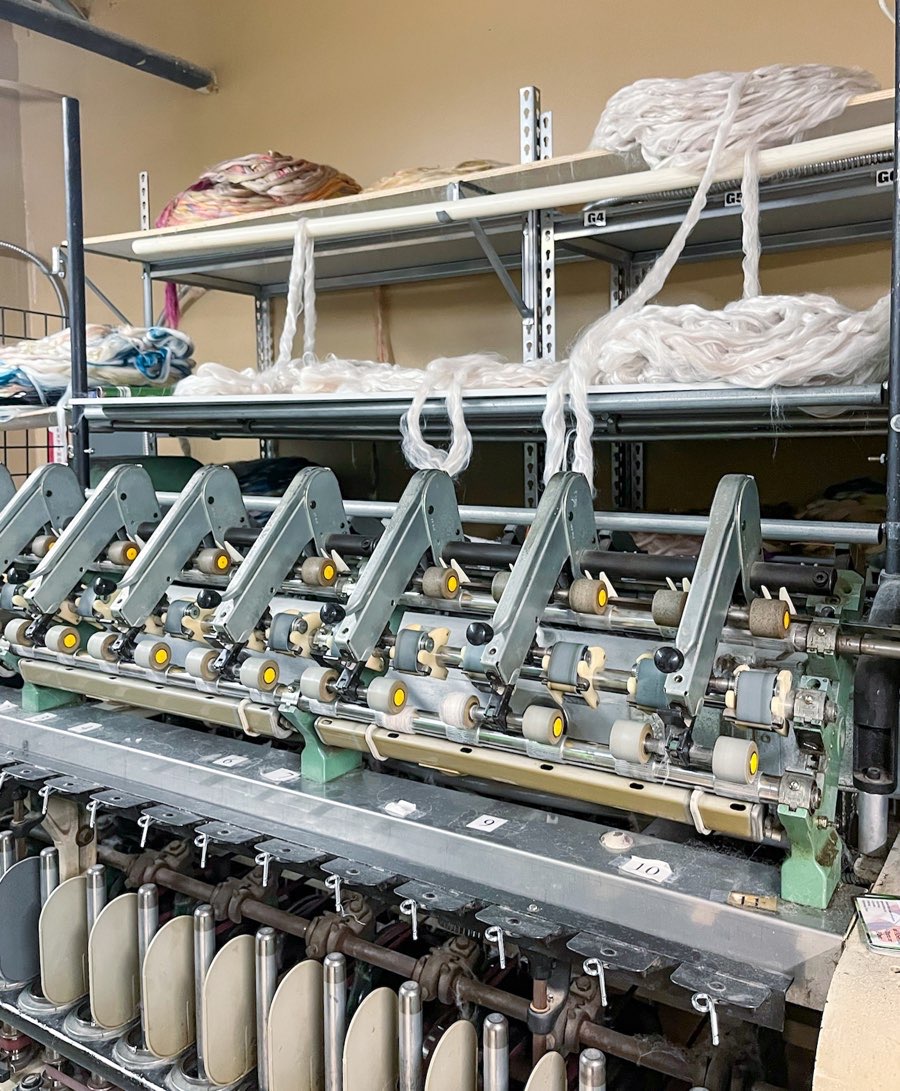 Weaving machine component, where fiber threads are woven into jaw-dropping and rare yarns; yarn crawl