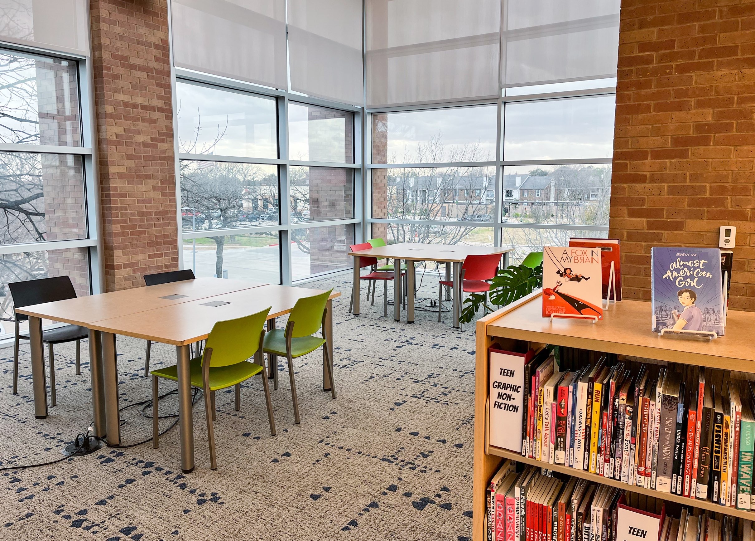 work area with tables and chairs at the Lewisville branch library