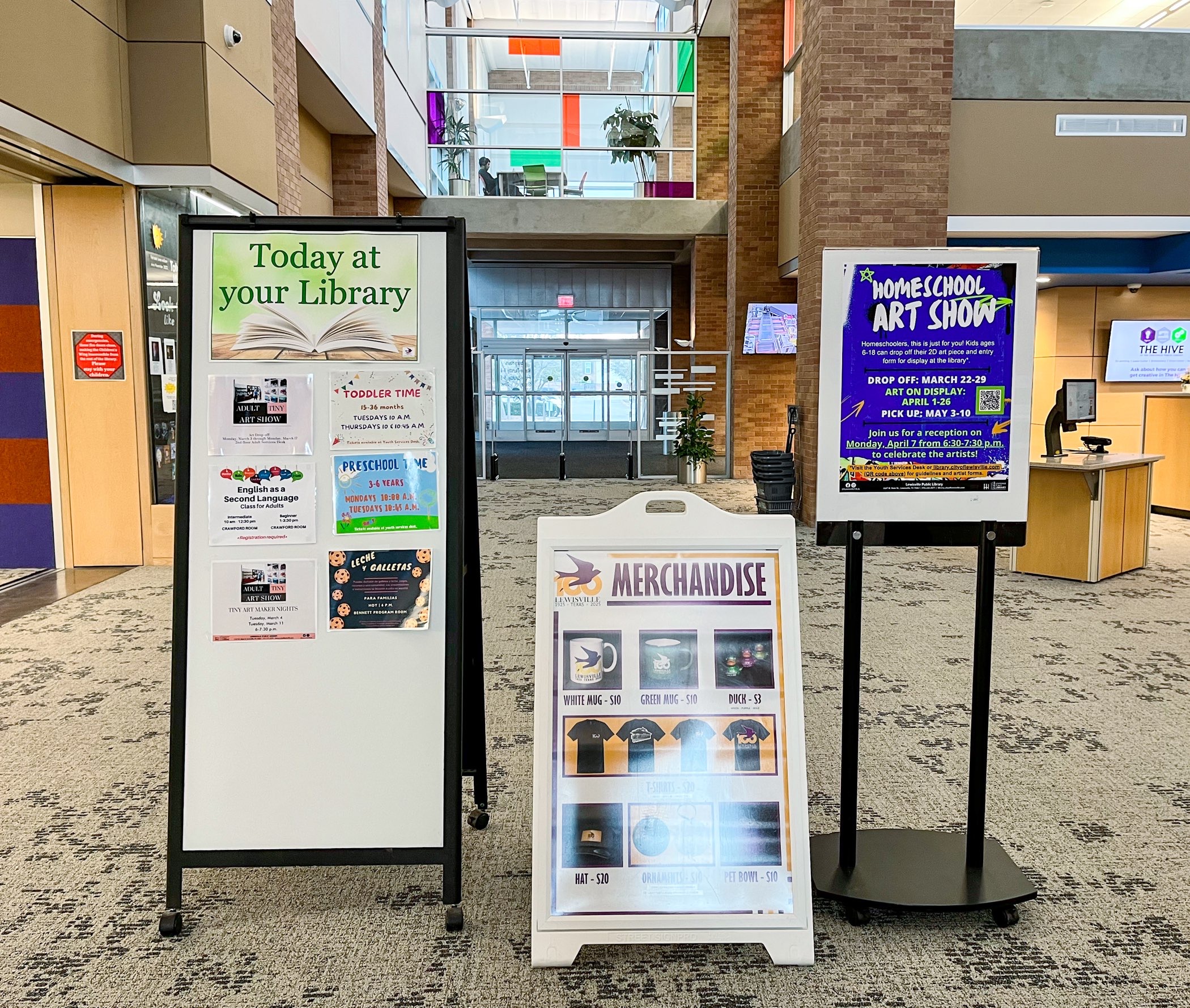 classes, merchandise and event posters at Lewisville branch library