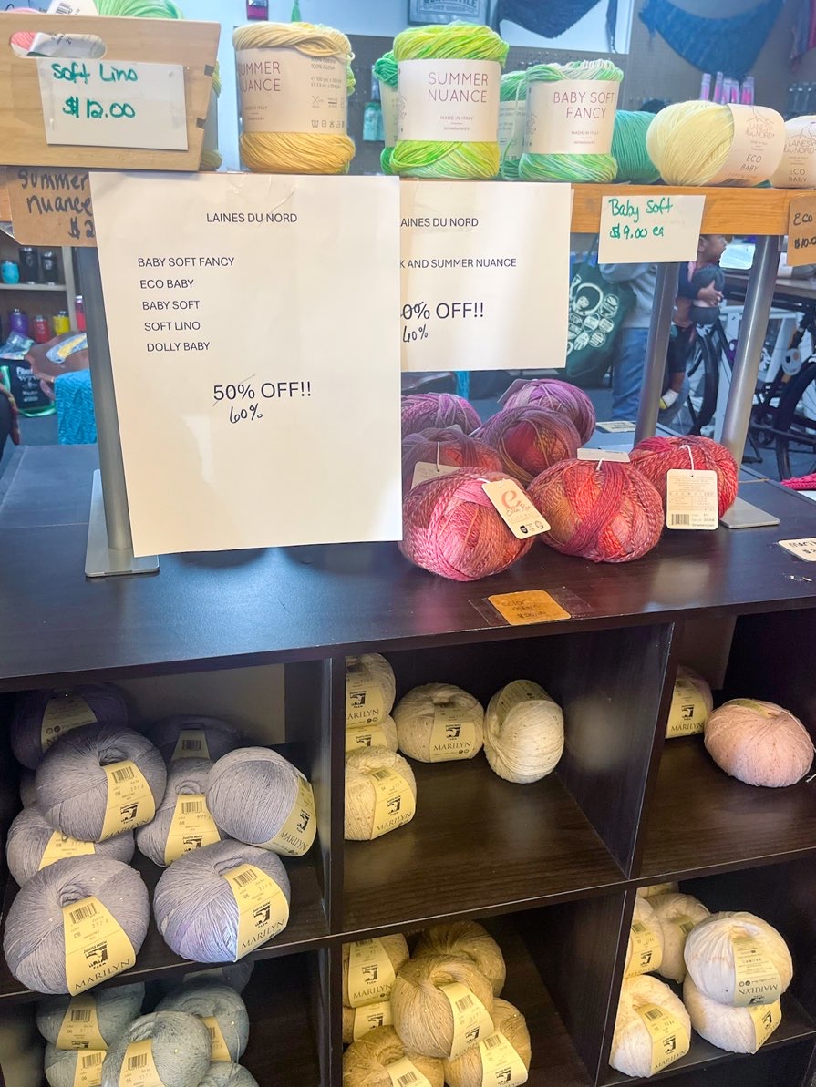 Cubbies full of neutral colored yarns