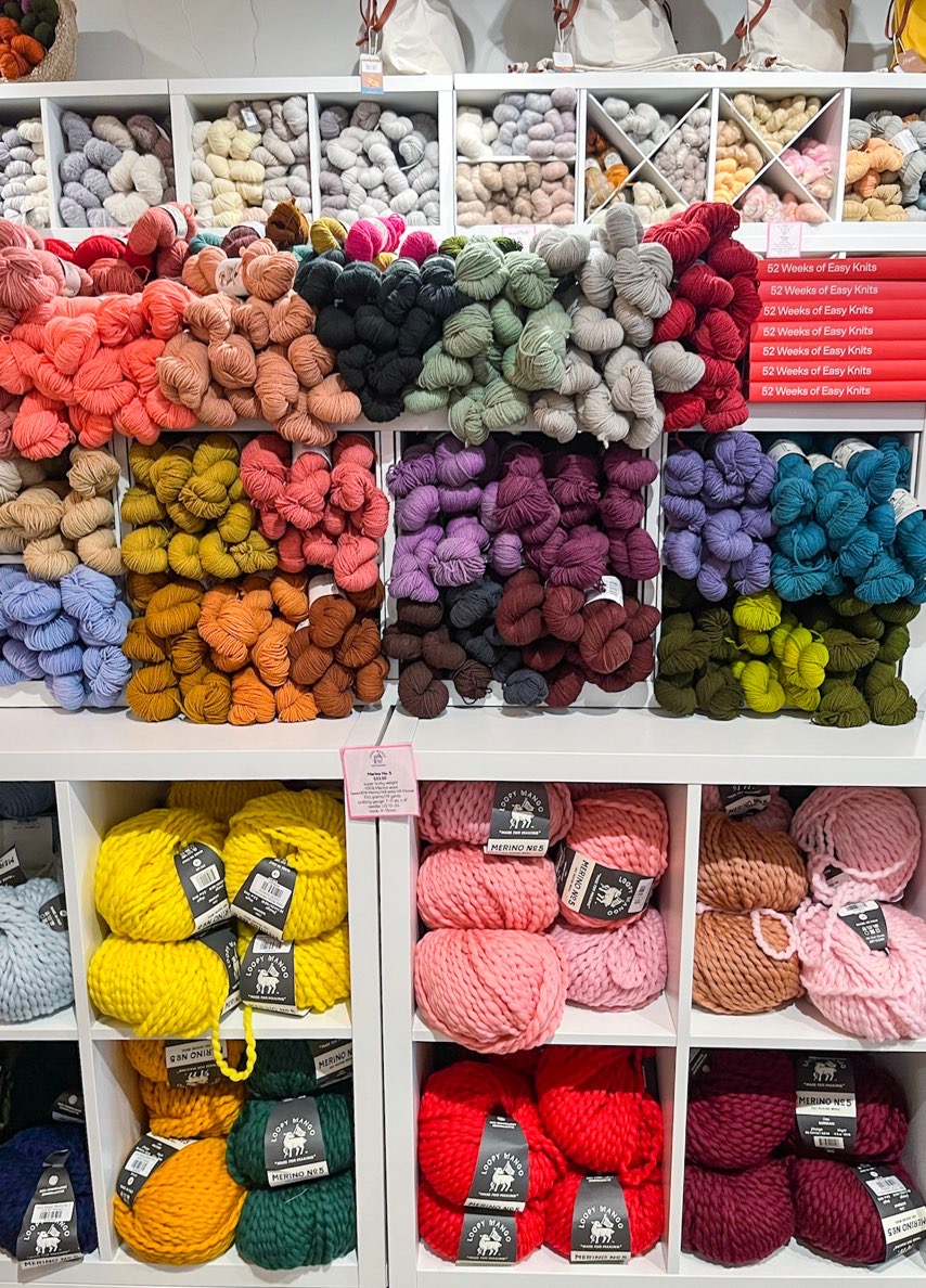 cubbies full of yarn in store at dfw fiber fest