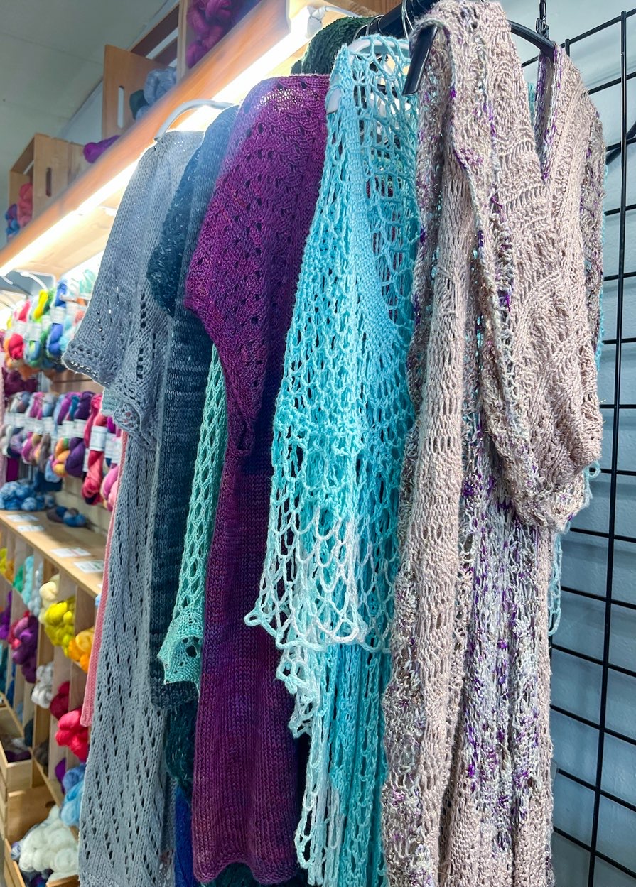Beautifully knitted shawls at Fiber Lady yarn shop