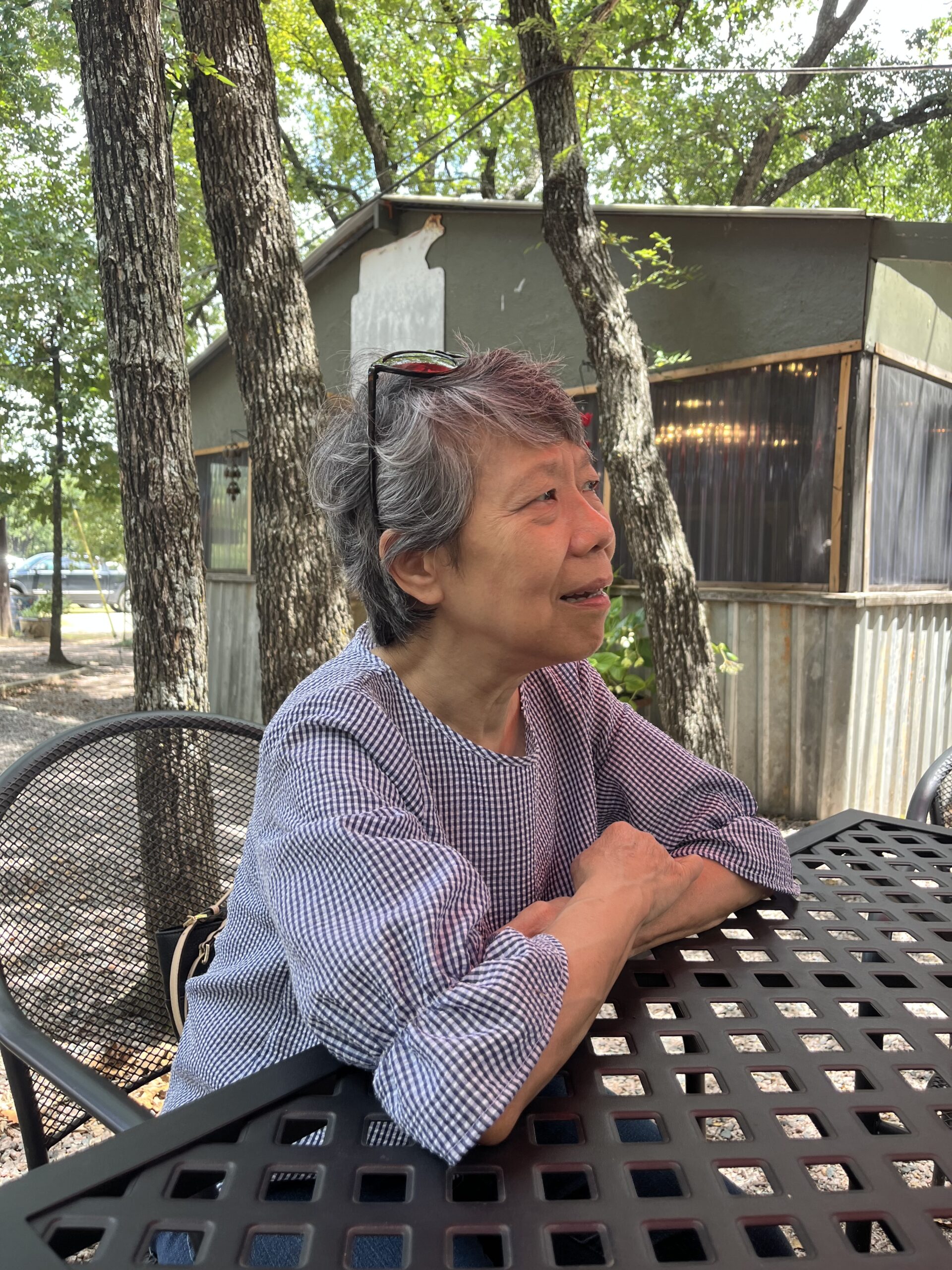 A visitor sitting at a picnic-style table at Lavender Ridge Farms.