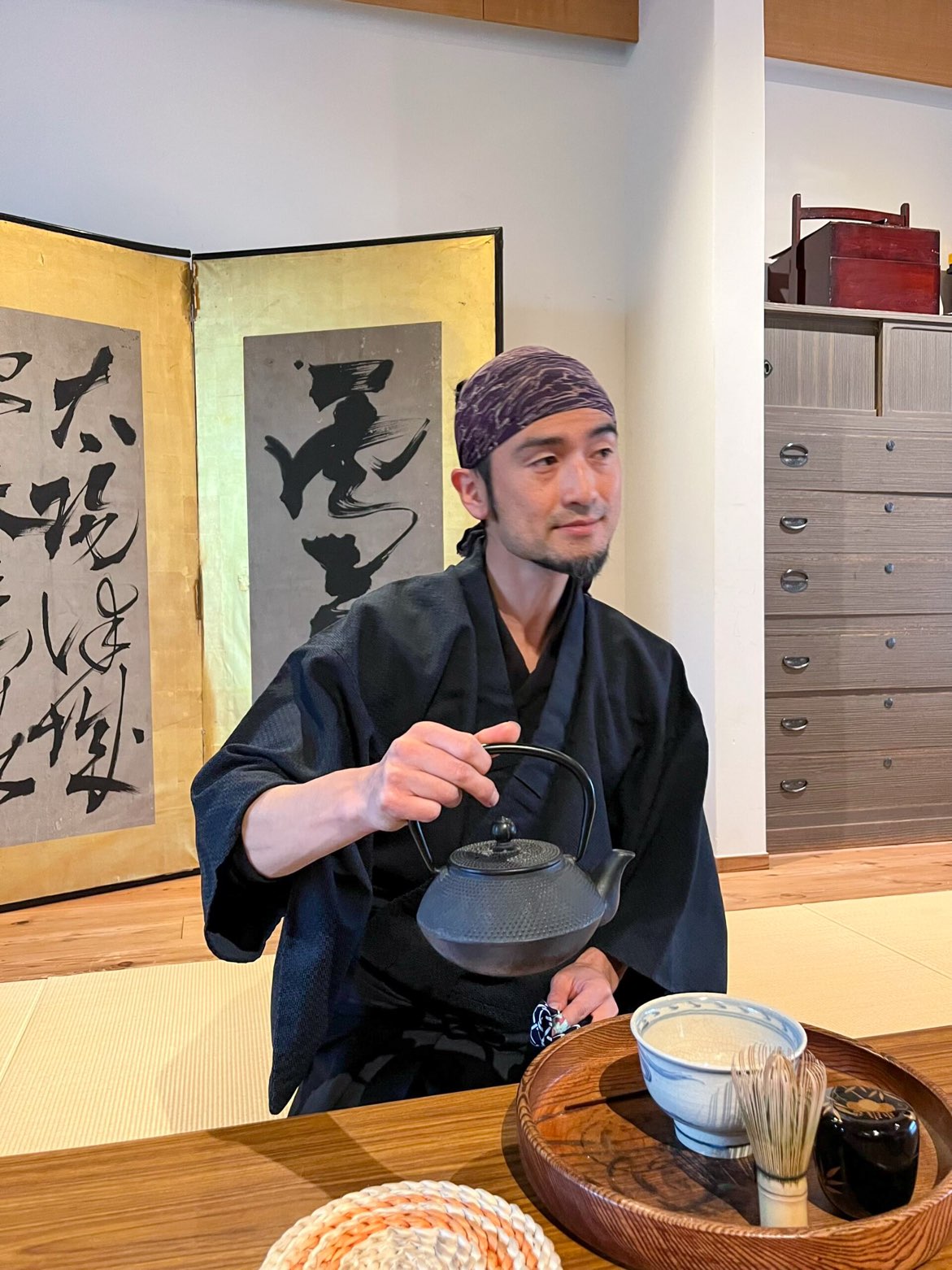 Participants enjoying a traditional Japanese tea ceremony before a samurai skills class in Sumida - Yahiro.