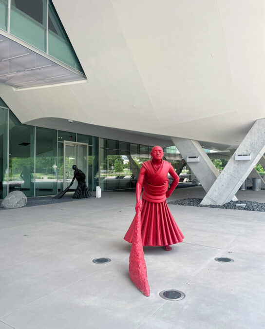 Statue of a figure sweeping outside the Crow Museum of Asian Art, one of the indoor activities in Dallas