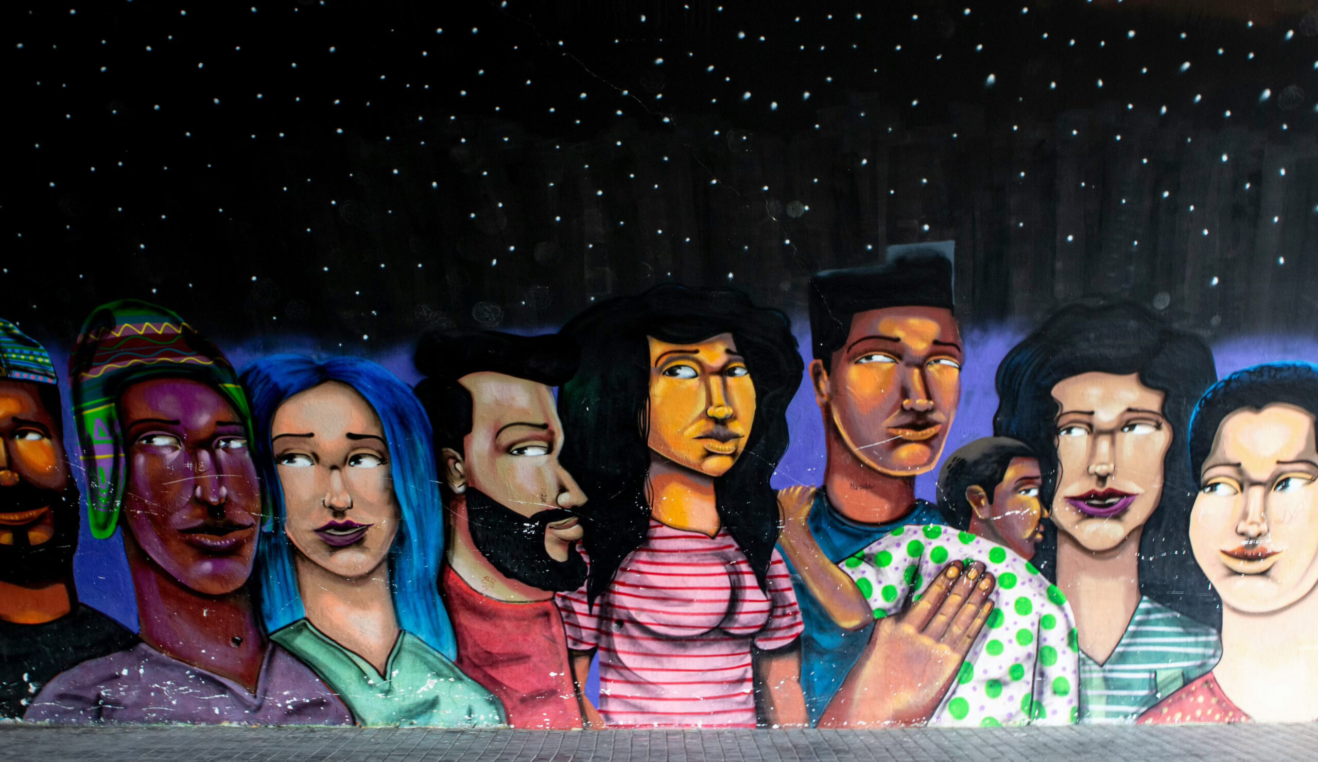 Painted picture of Latino men, women and child at Latino Cultural Center - one of the many free museums in Dallas 