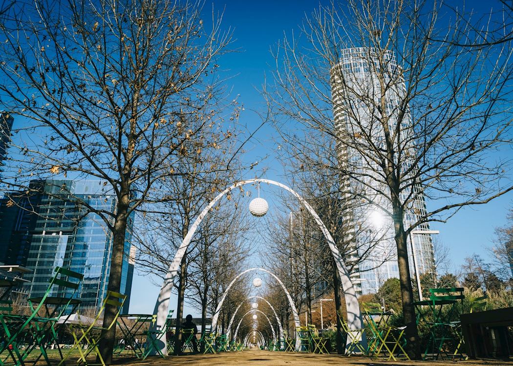 Shaded arch promenade with trees at Klyde Warren Park Dallas