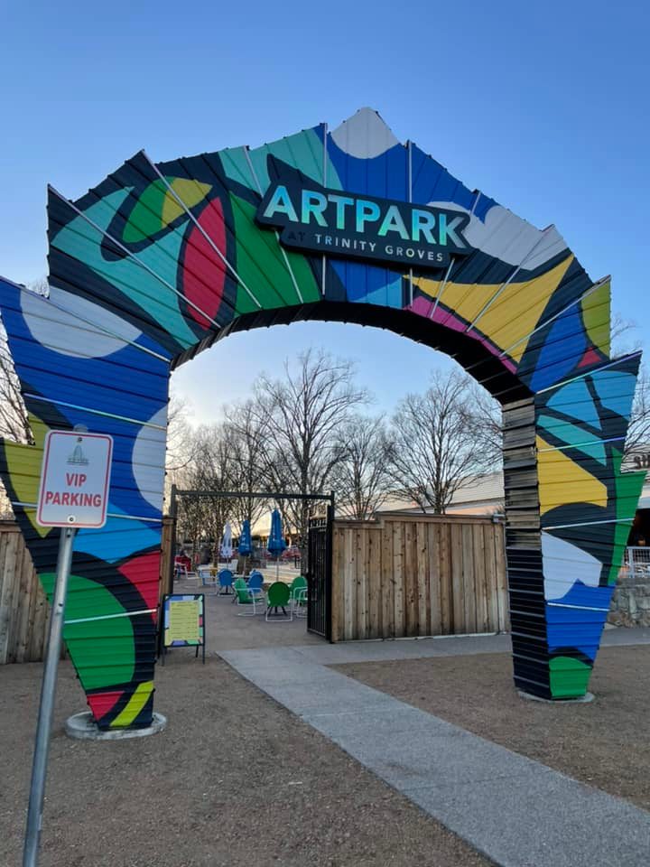 ArtPark Trinity Groves, one of the largest outdoor beer gardens in Dallas, offers space to sit outside, listen to live music when available, and relax while enjoying views of downtown Dallas and the Reunion Tower, part of free things to do in Dallas at night.