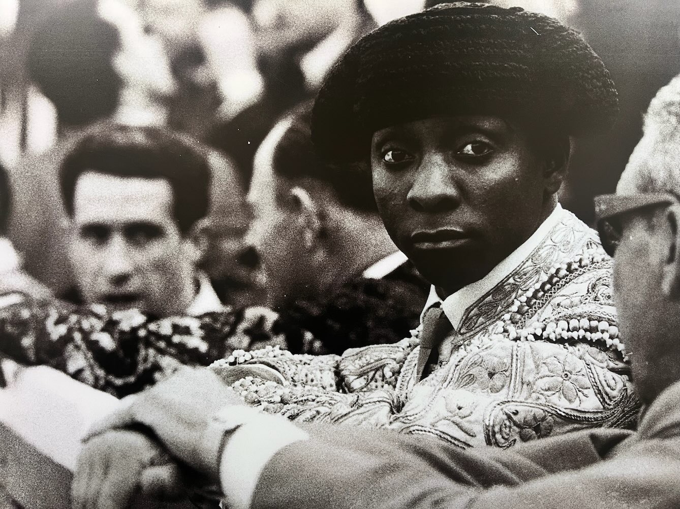 African American Museum of Dallas reviews exhibit featuring a young Black man dressed as a matador surrounded by onlookers