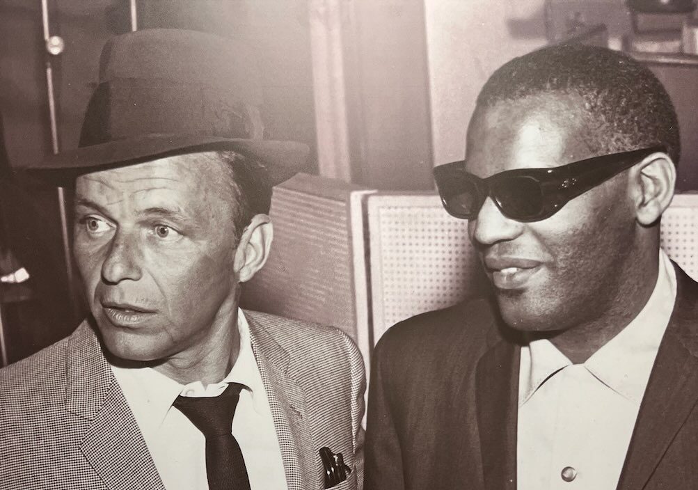 Frank Sinatra and Ray Charles displayed side by side at the African American Museum of Dallas reviews exhibit.