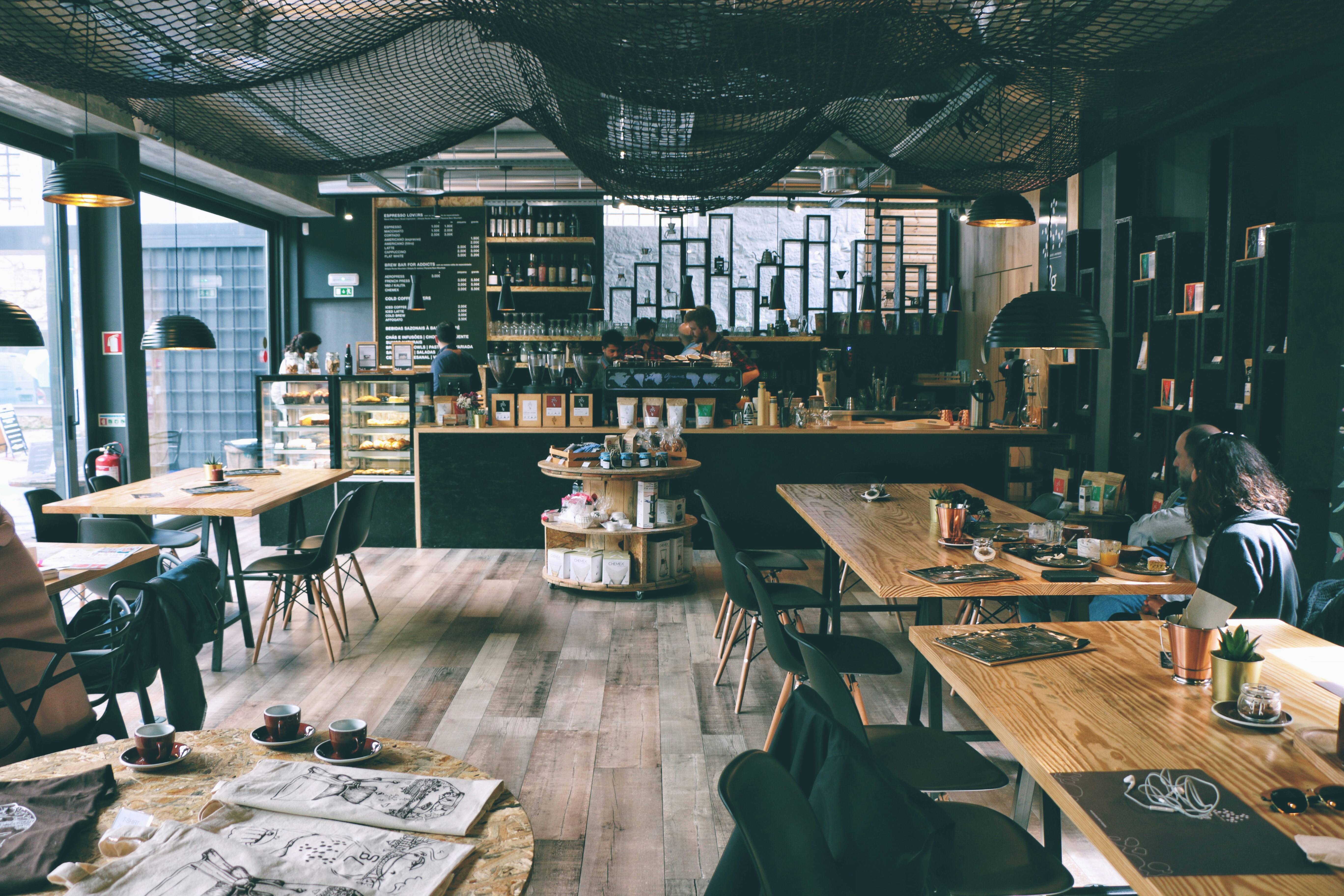 Welcoming coworking space with tables, chairs, workstations, coffee, and for studying or working late-night in the Dallas area.