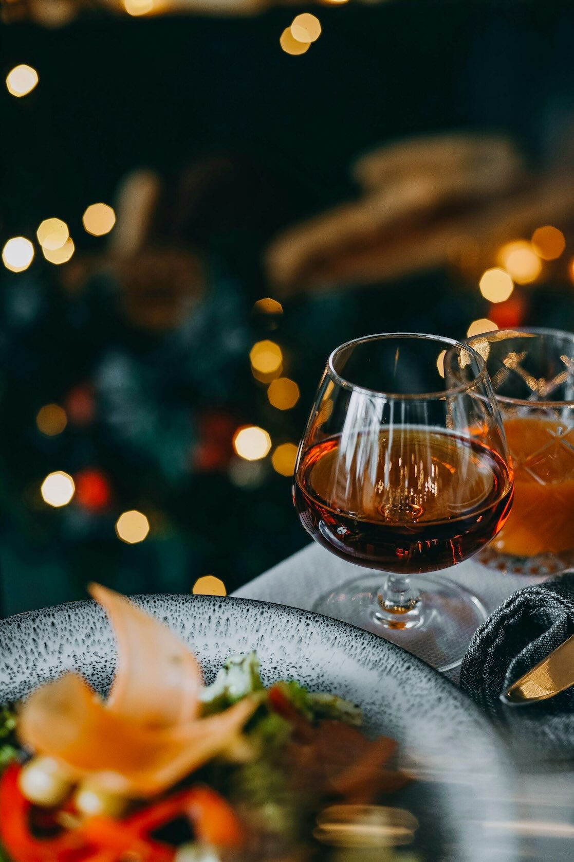 Prepared food and a drink aperitif served on a table at a Grapevine dining establishment during Christmas in Grapevine.