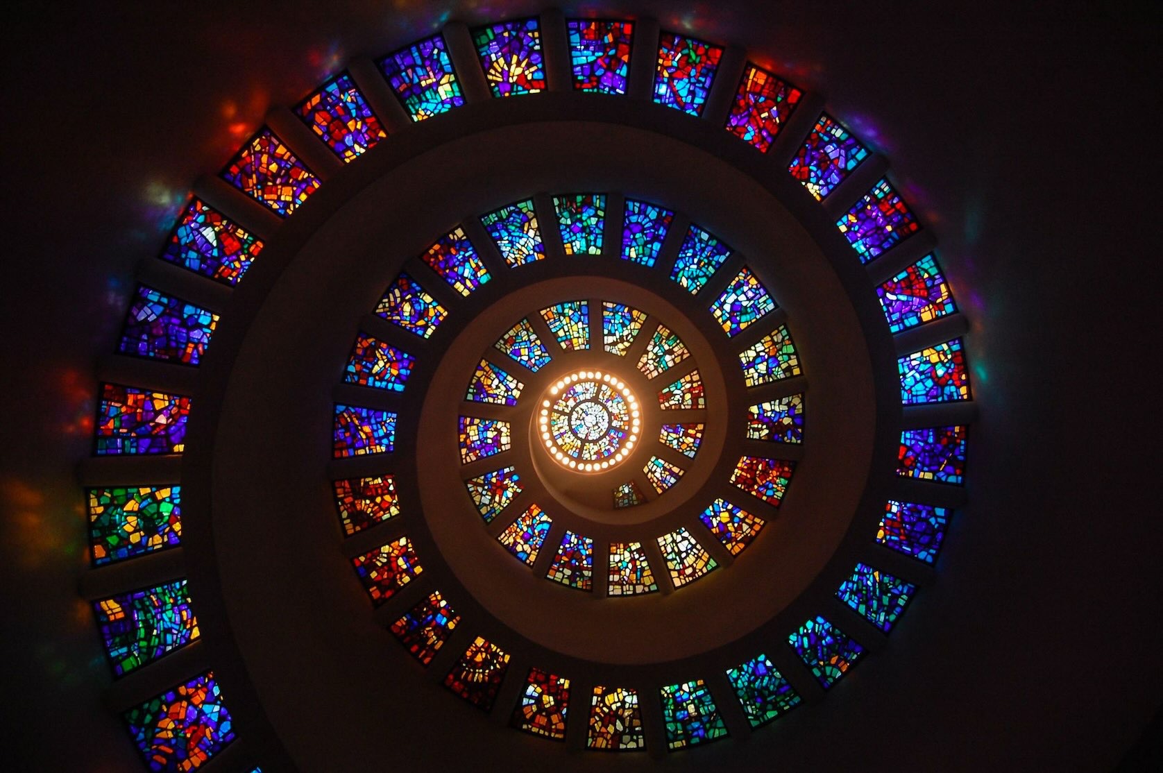 Colorful Glory Window stained glass spiral inside the Chapel of Thanks-Giving in downtown Dallas.
